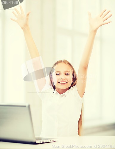 Image of girl with laptop pc at school