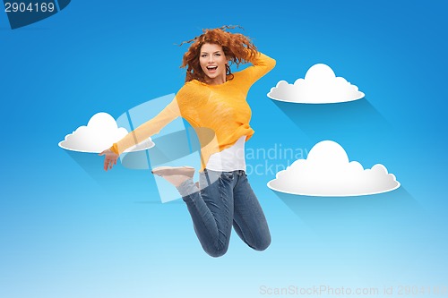 Image of smiling young woman jumping in air