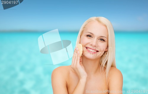 Image of beautiful woman with sponge