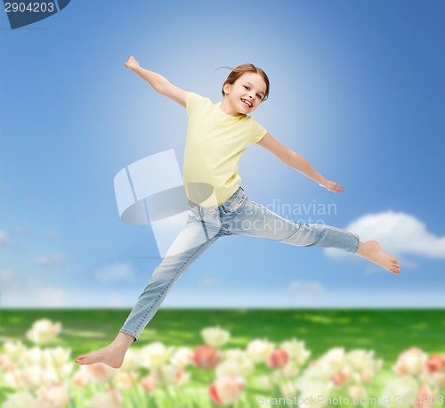 Image of smiling little girl jumping