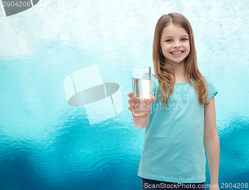 Image of smiling little girl giving glass of water