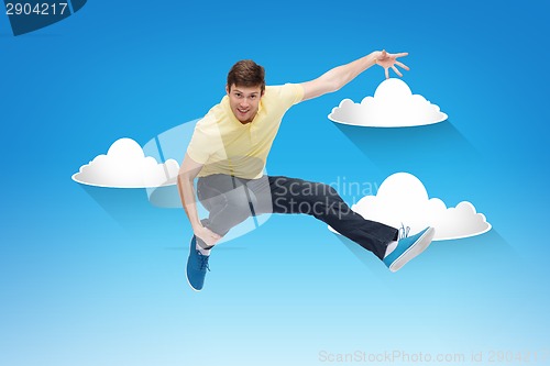 Image of smiling young man jumping in air