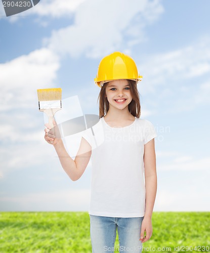 Image of smiling little girl in helmet with paint brush
