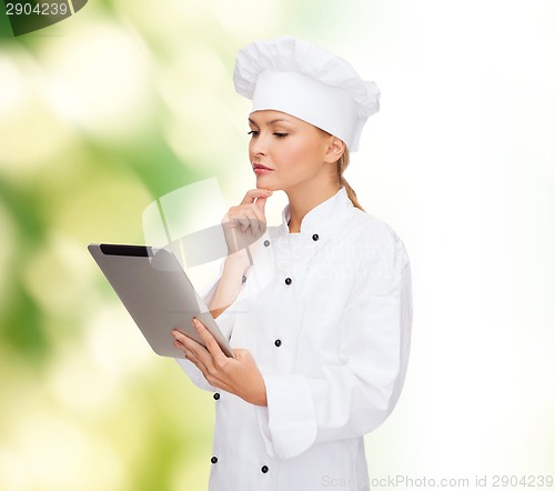 Image of smiling female chef with tablet pc computer