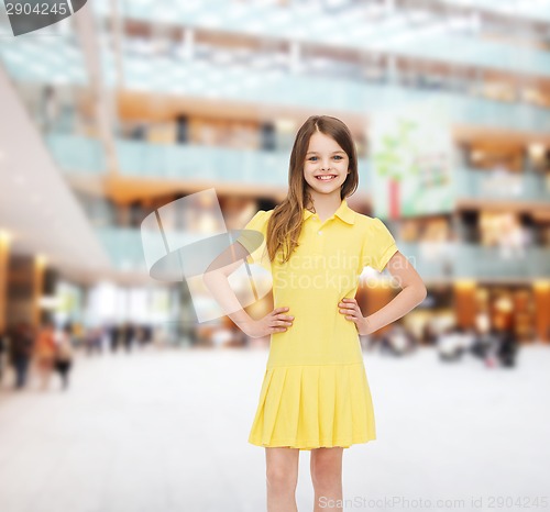 Image of smiling little girl in yellow dress