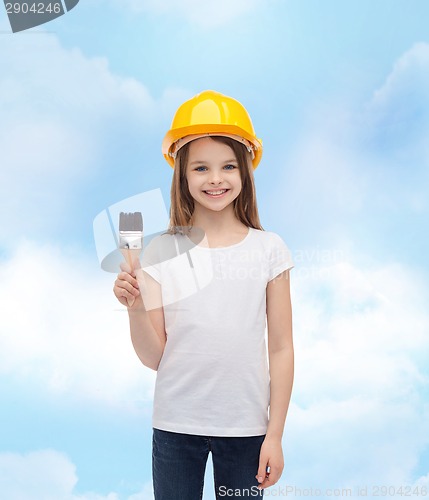 Image of smiling little girl in helmet with paint roller