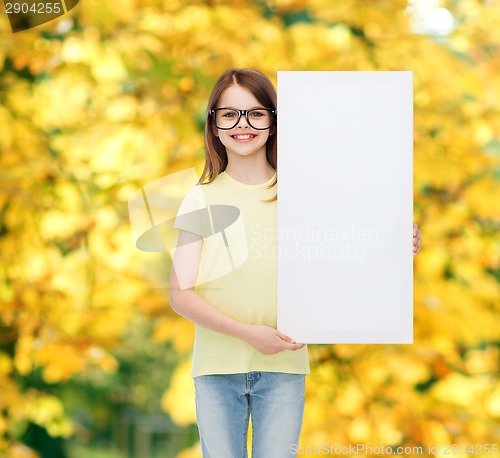 Image of little girl wearing eyeglasses with blank board