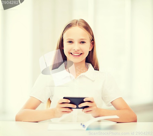Image of girl with smartphone at school