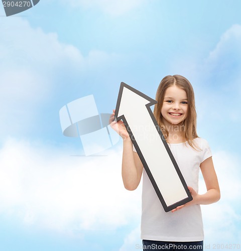 Image of smiling little girl with blank arrow pointing up