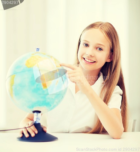 Image of student girl with globe at school