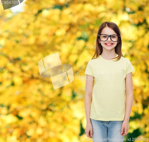 Image of smiling cute little girl in black eyeglasses