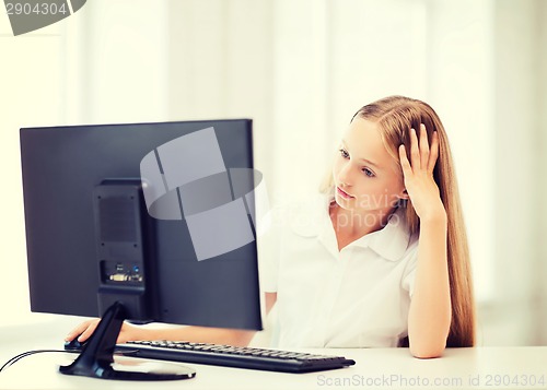 Image of student girl with computer at school