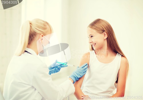 Image of doctor doing vaccine to child in hospital