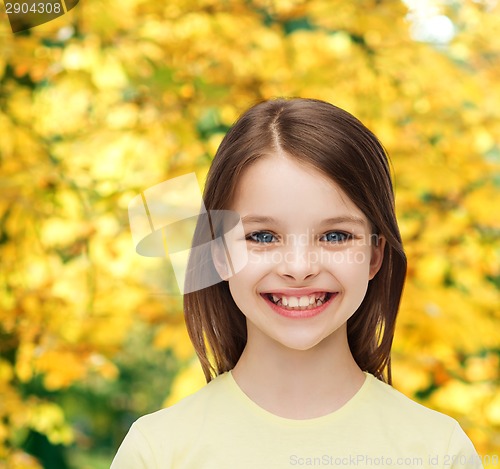 Image of smiling little girl over white background