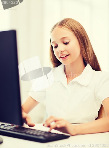 Image of student girl with computer at school