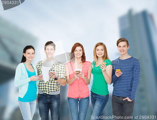 Image of smiling students with smartphones