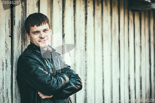 Image of Handsome man outdoors portrait. Autumn colors.