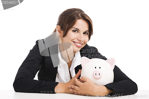 Image of Businesswoman with a piggy bank