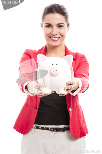 Image of Business woman with a piggy bank