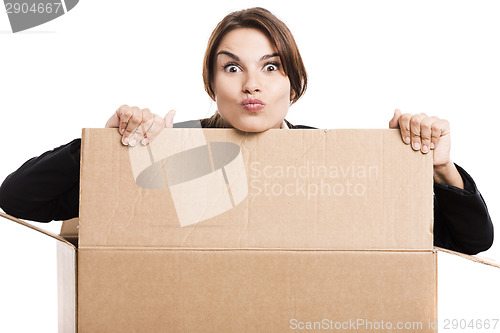 Image of Business woman appear inside a big card box