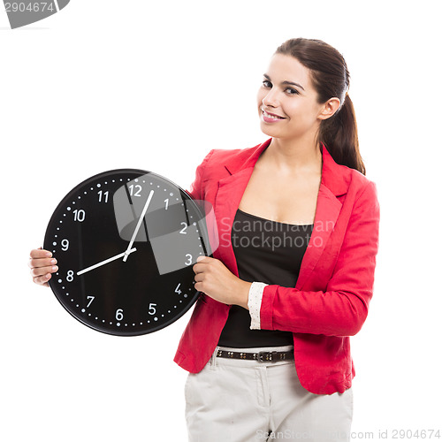 Image of Business woman holding a clock