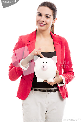 Image of Business woman with a piggy bank