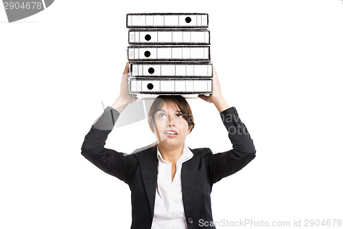Image of Business woman carying folders