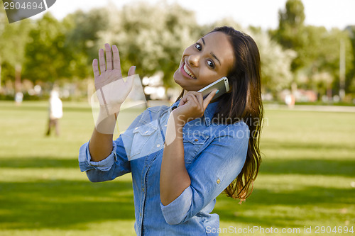 Image of Beautiful woman talking at phone