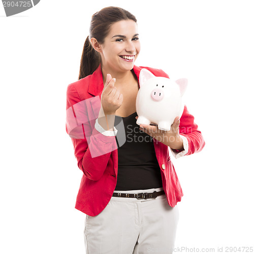 Image of Business woman with a piggy bank