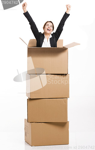 Image of Business woman appear inside a big card box