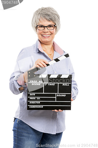 Image of Elderly woman holding a clapboard