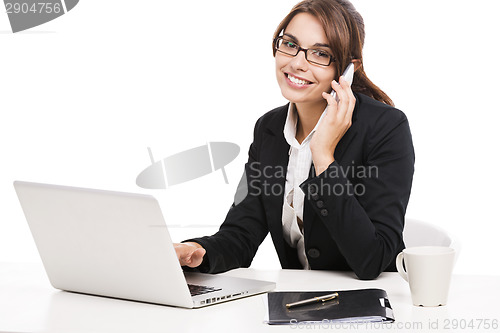 Image of Businesswoman answering phone