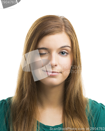 Image of Beautiful young woman blinking eye