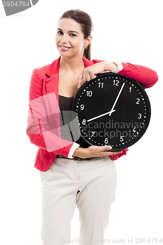 Image of Business woman holding a clock