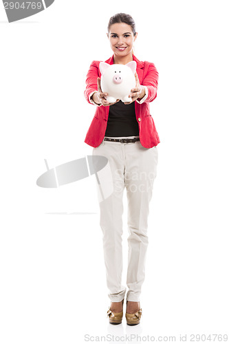 Image of Business woman with a piggy bank