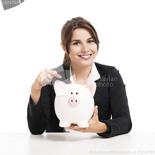Image of Businesswoman with a piggy bank