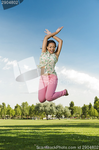 Image of Beautiful African American woman jumping