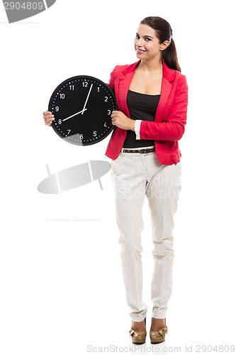 Image of Business woman holding a clock