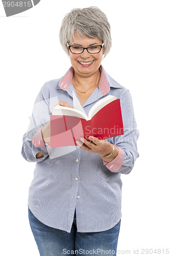 Image of Elderly woman reading a book