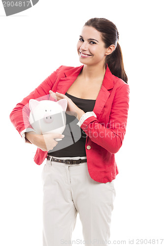 Image of Business woman with a piggy bank