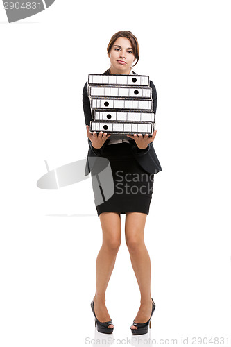 Image of Business woman carying folders