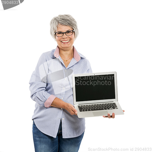 Image of Elderly woman showing something on a laptop