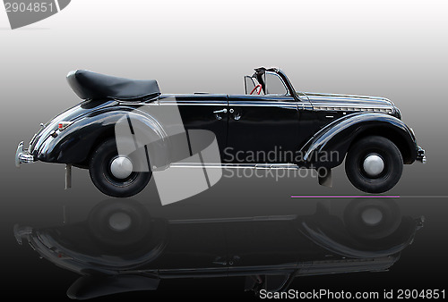 Image of retro car isolated on the dark background