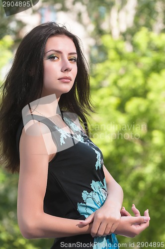 Image of Attractive girl relaxes over nature background