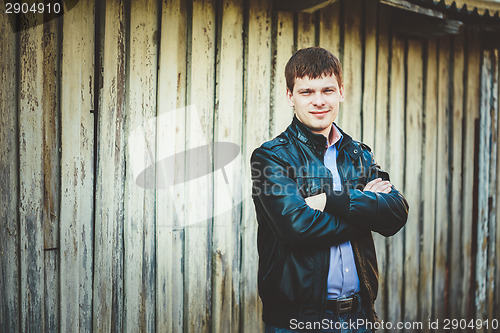 Image of Handsome man outdoors portrait. Autumn colors.