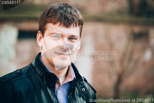 Image of Handsome Man Outdoors Portrait. Autumn Colors.