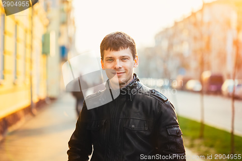 Image of Handsome Man Outdoors Portrait. Autumn Colors.
