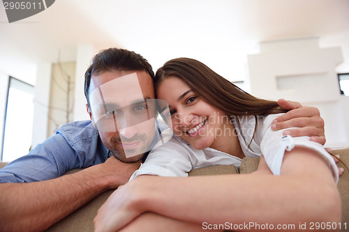 Image of relaxed young couple at home