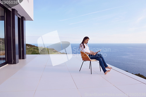 Image of relaxed young womant at home