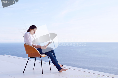 Image of relaxed young womant at home